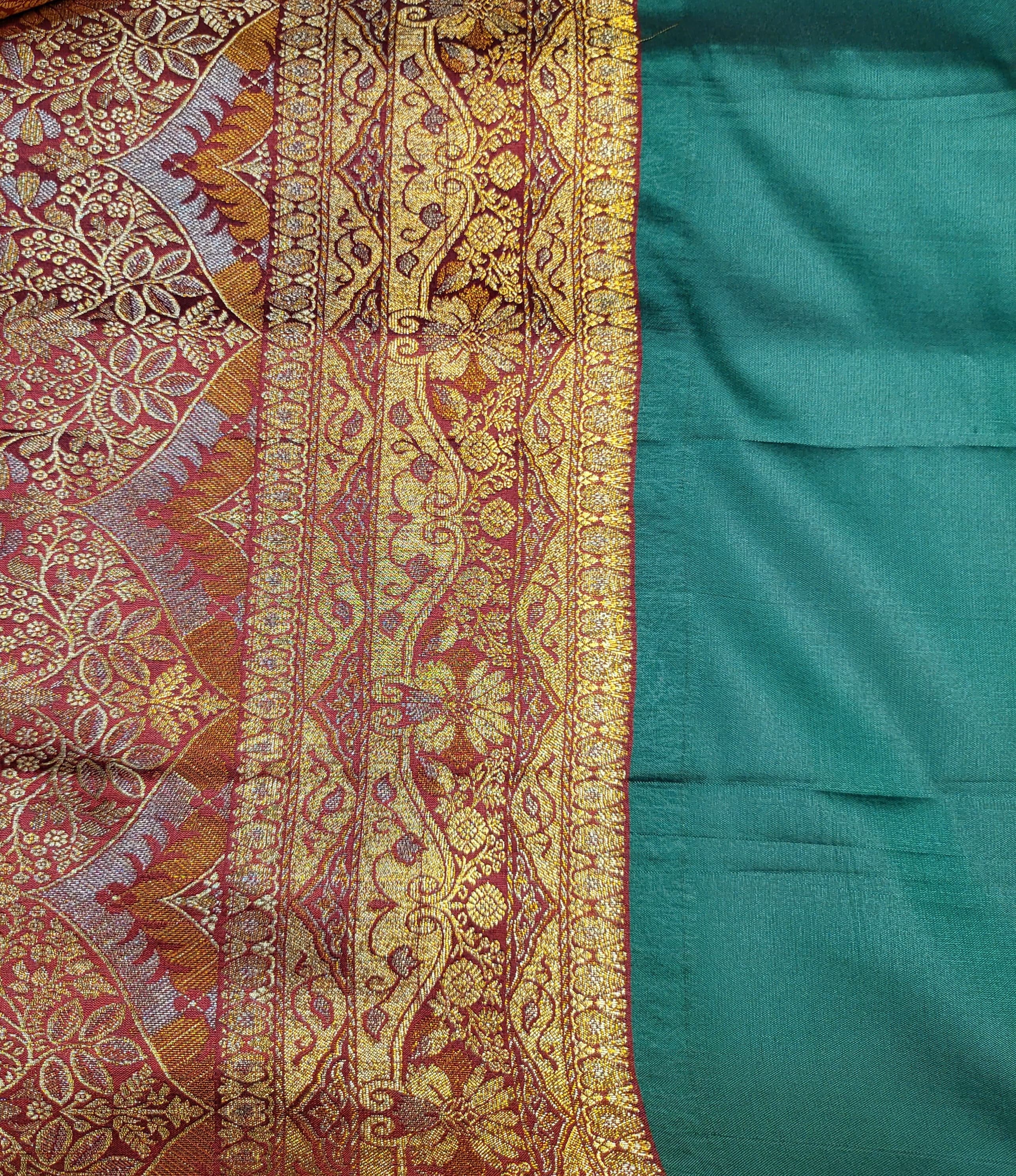 Radiant Elegance: Embrace Timeless Beauty with Our Green and Golden Banarasi Silk Saree