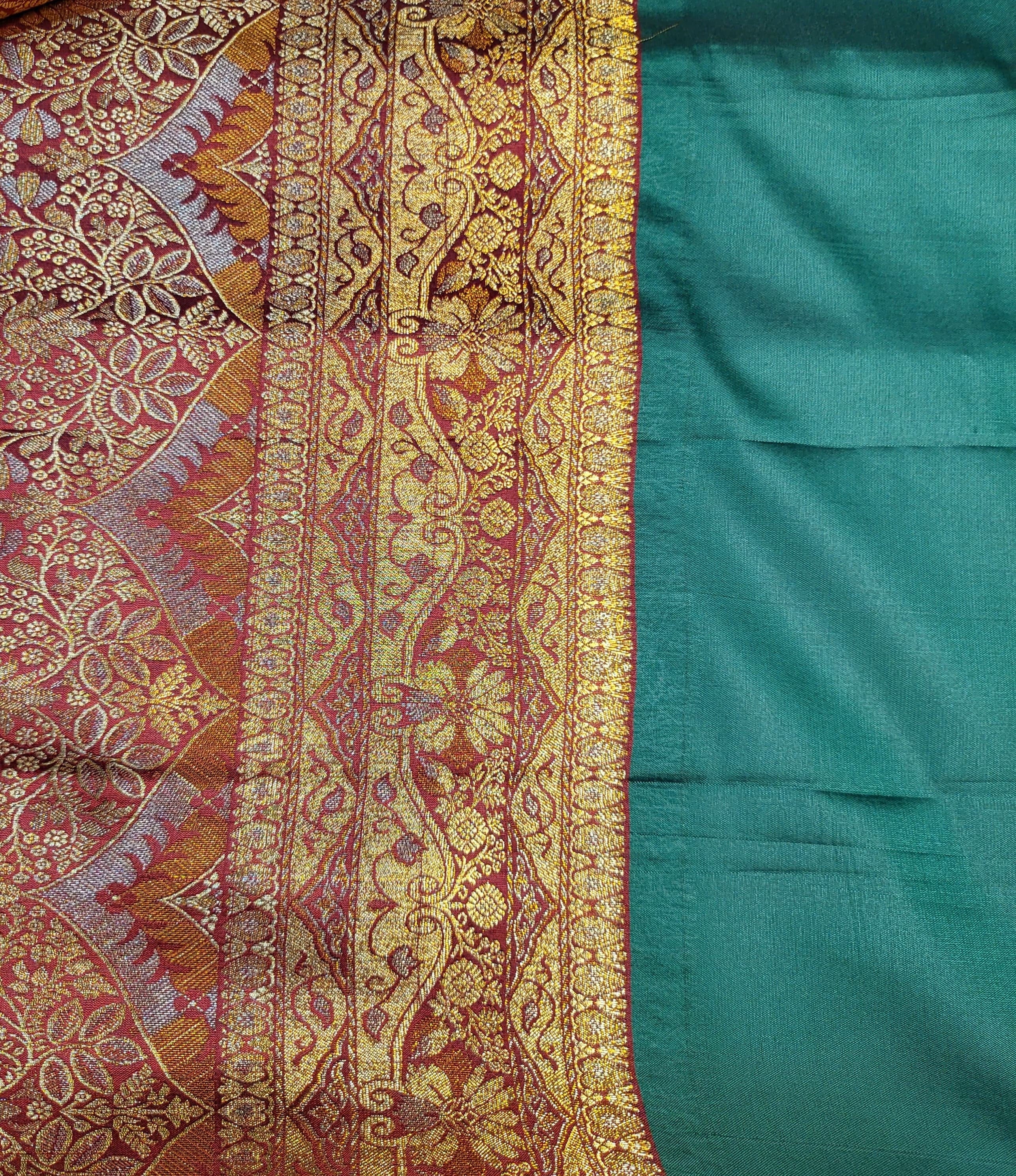 Radiant Elegance: Embrace Timeless Beauty with Our Green and Golden Banarasi Silk Saree